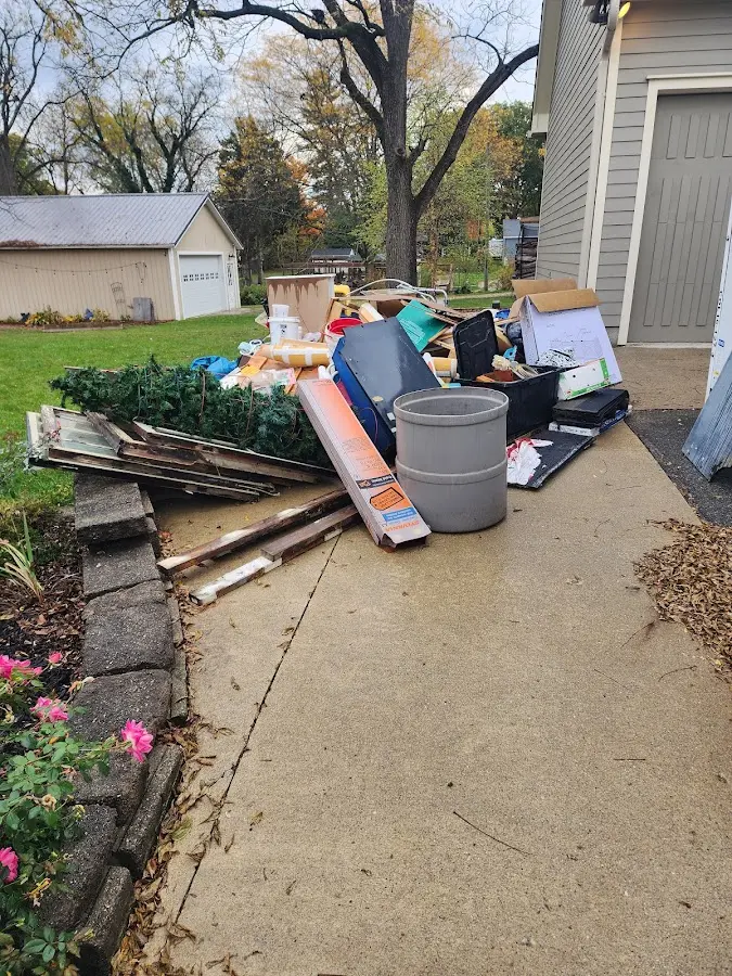 Dumpster being loaded with debris for Roofing Dumpster Rental in Squaw Valley